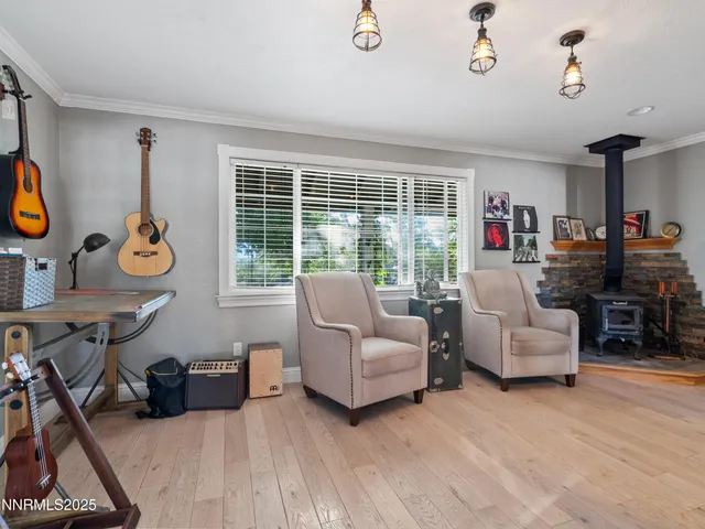 a kitchen with stainless steel appliances granite countertop a refrigerator a sink dishwasher a stove and a refrigerator with wooden cabinets