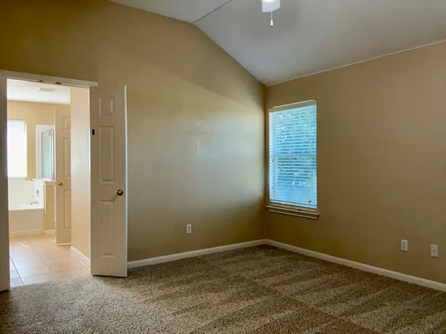 an empty room that has a bathroom