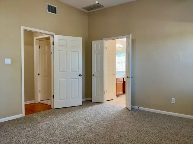 a bathroom with a granite countertop sink mirror and a bathtub