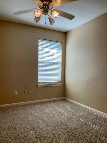 a view of a hallway with a room and yard
