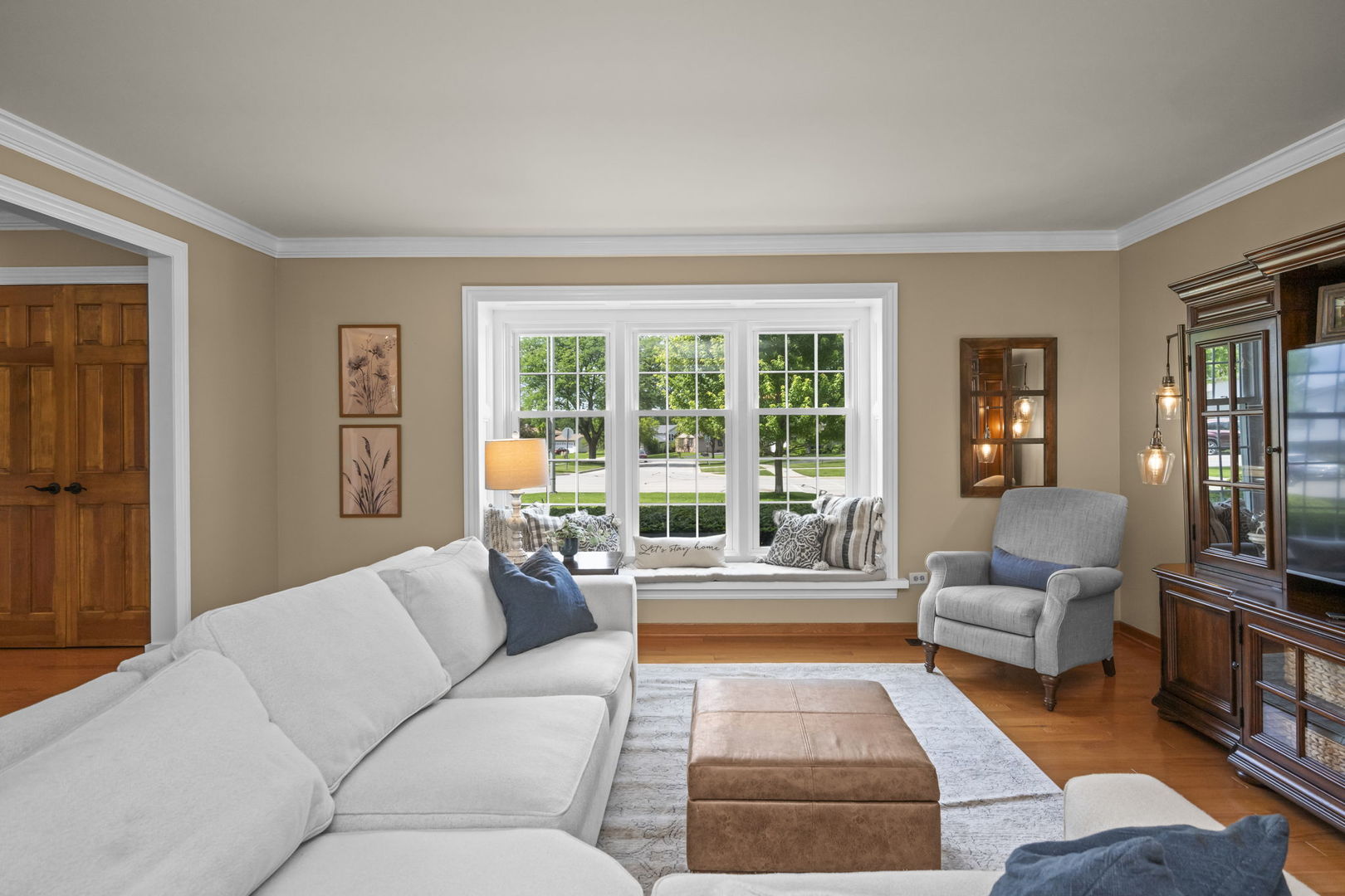 1565 Freeman Road Hoffman Estates, IL 60192 - Photo 12 of 46 a living room with furniture and a large window