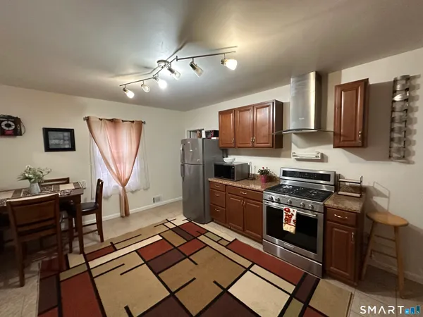 view of a bathroom with a toilet and a shower