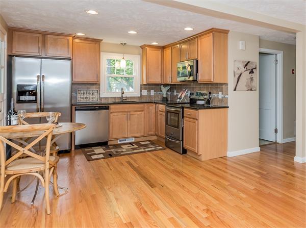 104 Roy Street Springfield, MA 01104 - Photo 1 of 30 a kitchen with stainless steel appliances granite countertop a stove a sink and a refrigerator