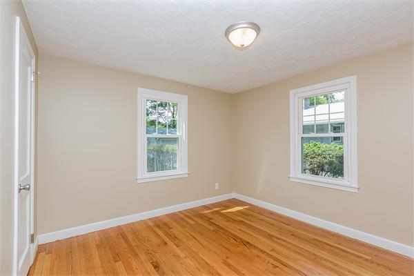 104 Roy Street Springfield, MA 01104 - Photo 21 of 30 a view of an empty room with wooden floor and a window