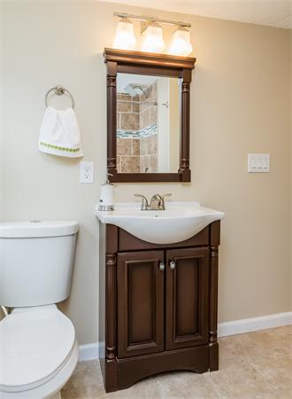 104 Roy Street Springfield, MA 01104 - Photo 30 of 30 a bathroom with a toilet sink and mirror