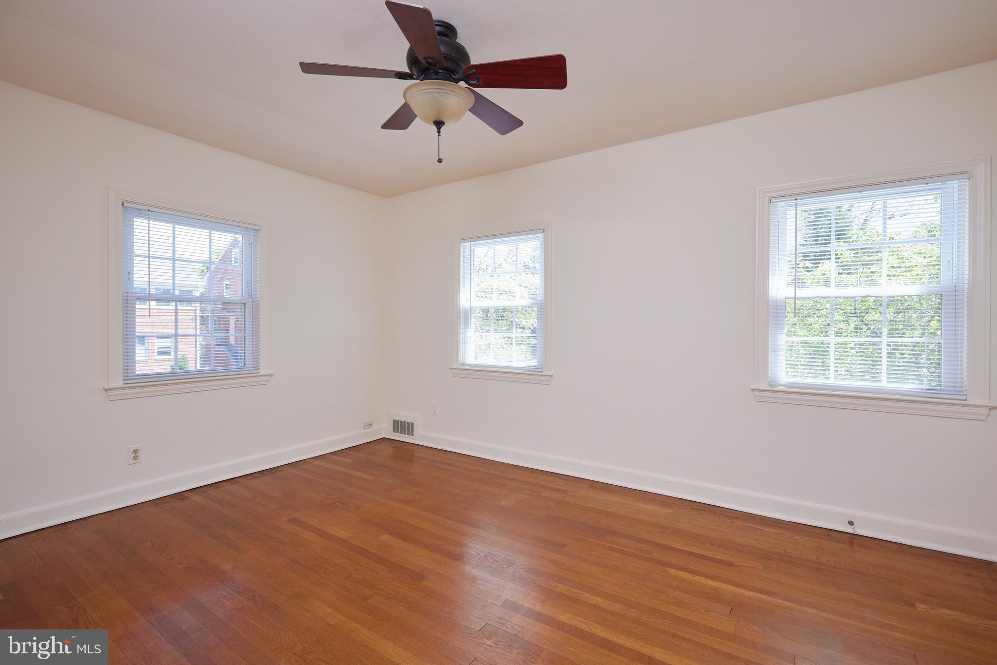 3501 Alton Place Northwest Washington, DC 20008 - Photo 13 of 29 a view of empty room with wooden floor and fan