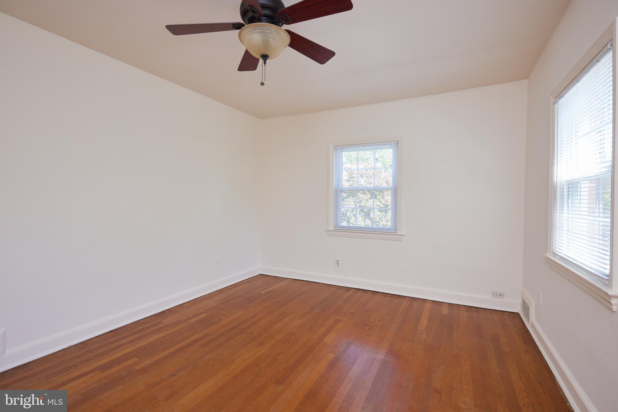 3501 Alton Place Northwest Washington, DC 20008 - Photo 15 of 29 an empty room with a window and a fan