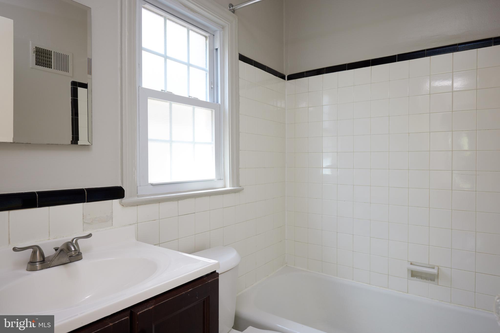 3501 Alton Place Northwest Washington, DC 20008 - Photo 18 of 29 a bathroom with a sink and a bathtub