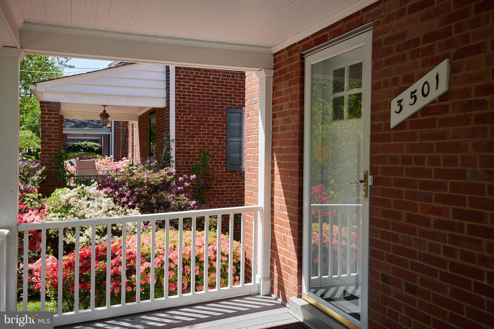 3501 Alton Place Northwest Washington, DC 20008 - Photo 4 of 29 a view of a house with a small yard and wooden fence