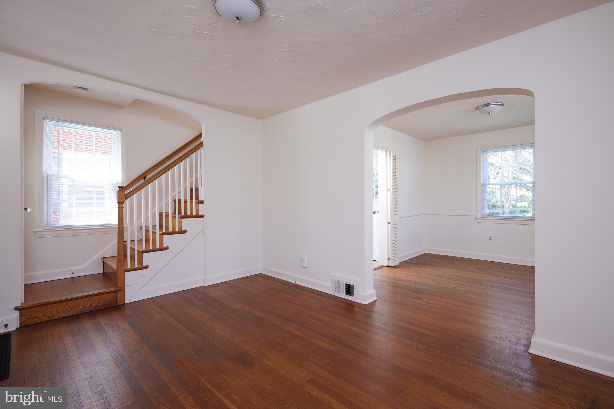 3501 Alton Place Northwest Washington, DC 20008 - Photo 6 of 29 a view of an empty room with wooden floor and a window