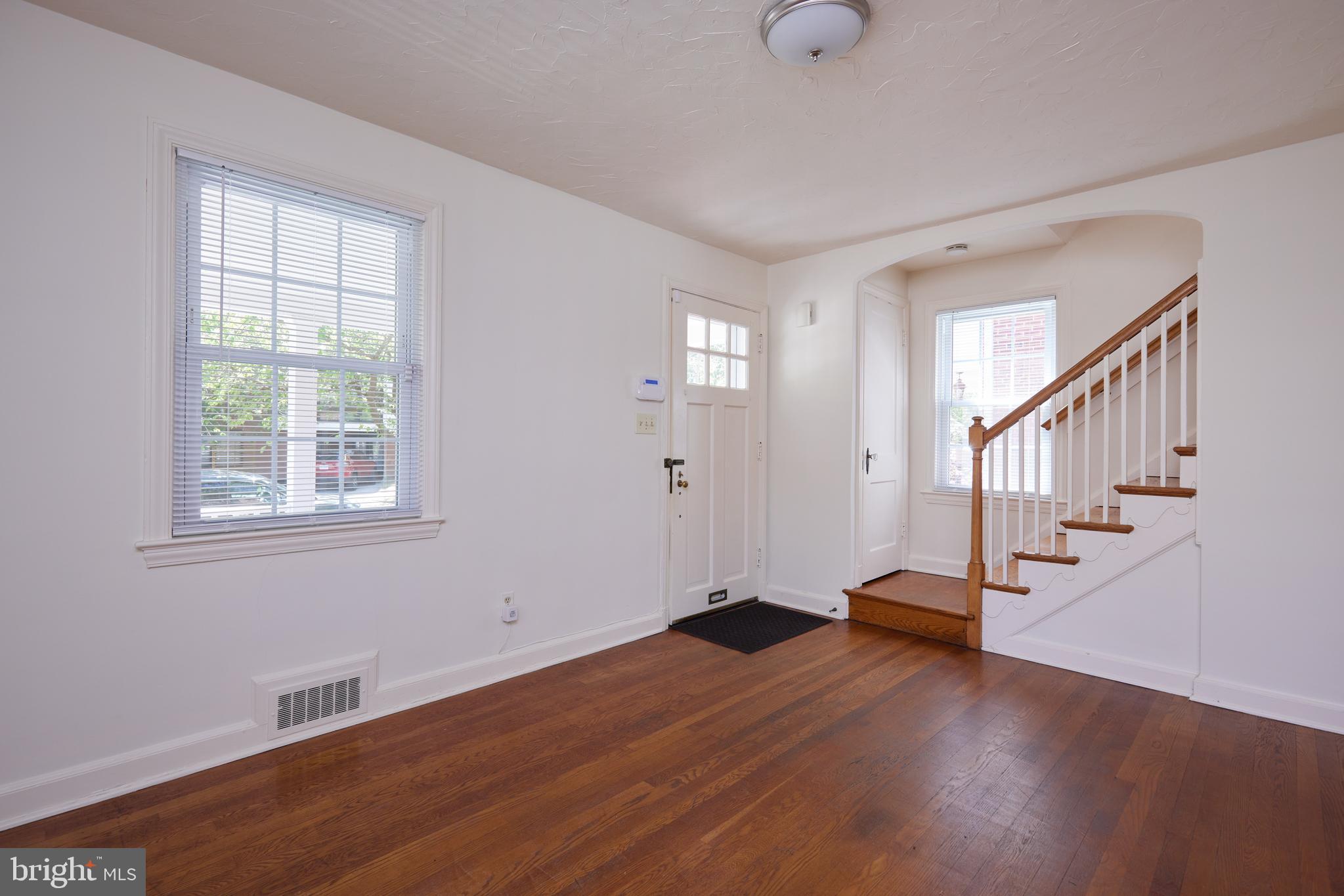 3501 Alton Place Northwest Washington, DC 20008 - Photo 7 of 29 a view of an empty room with wooden floor and a window