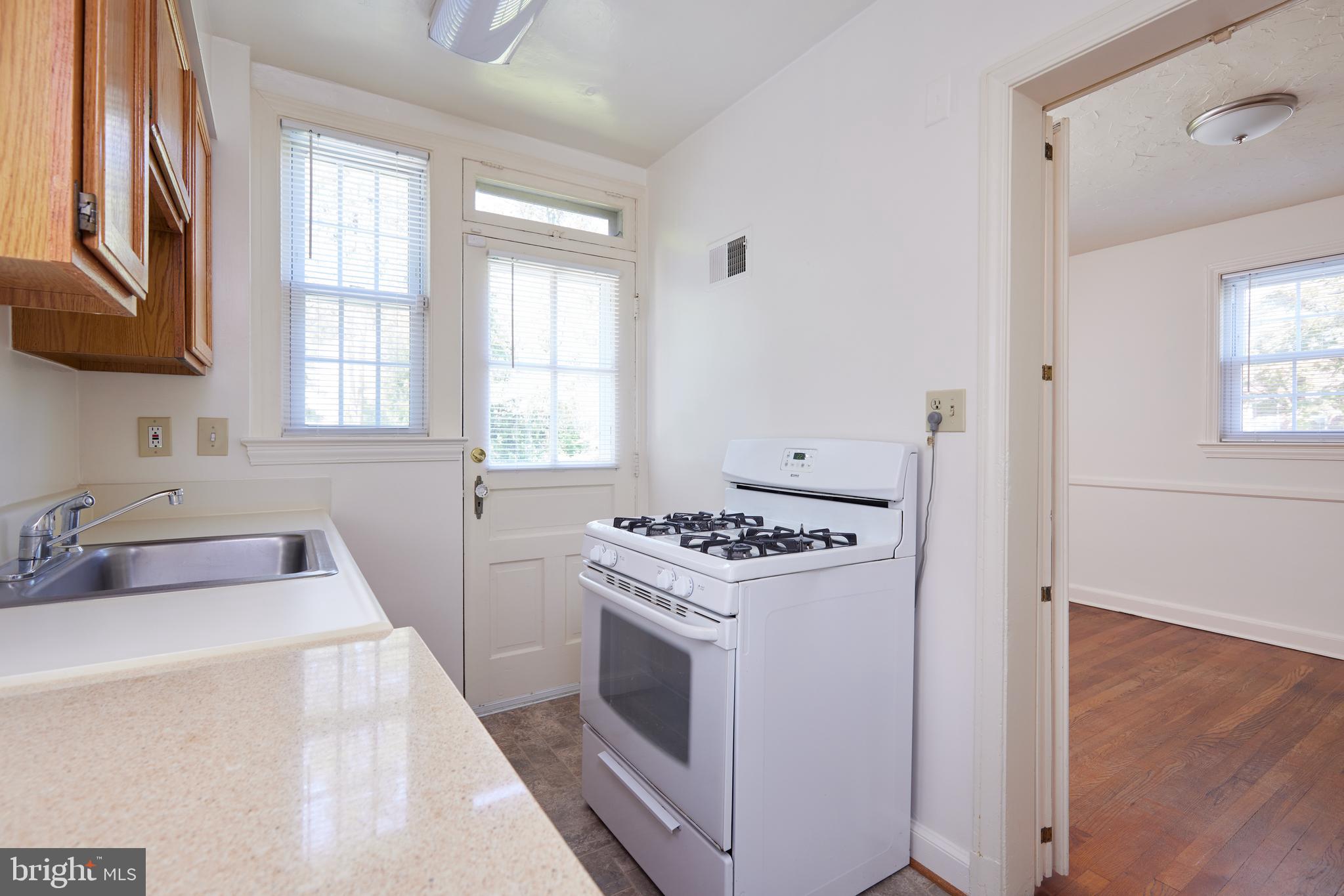3501 Alton Place Northwest Washington, DC 20008 - Photo 10 of 29 a kitchen with a stove and a sink
