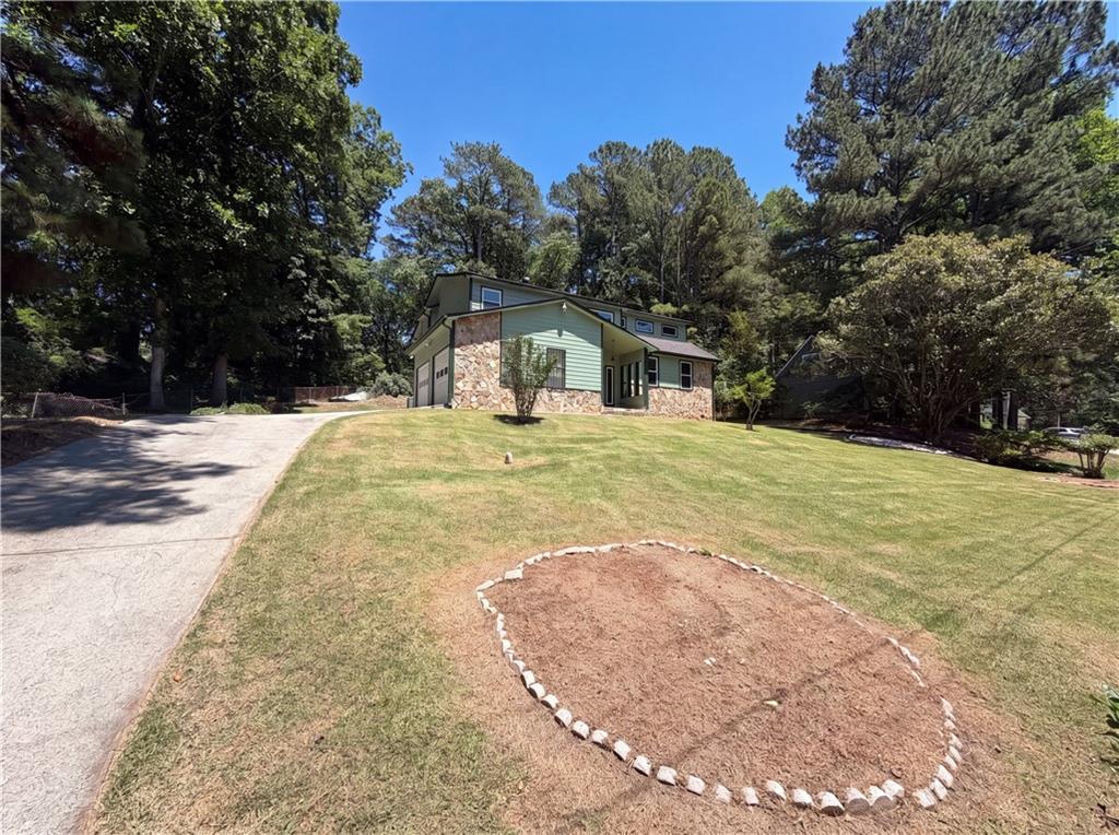 6830 Earlhurst Road Atlanta, GA 30349 - Photo 4 of 27 a view of a house with a yard