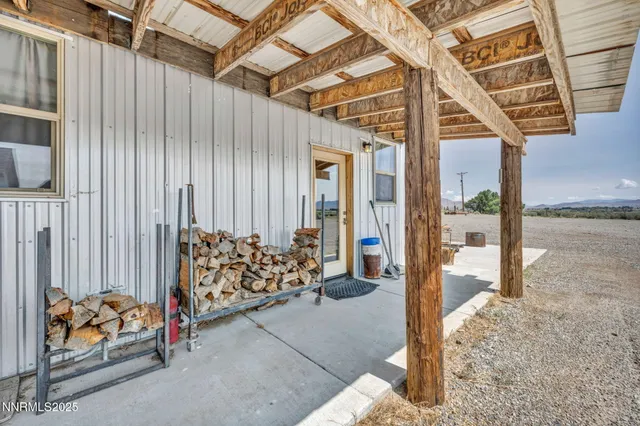 a outdoor space with sliding door and wooden bench