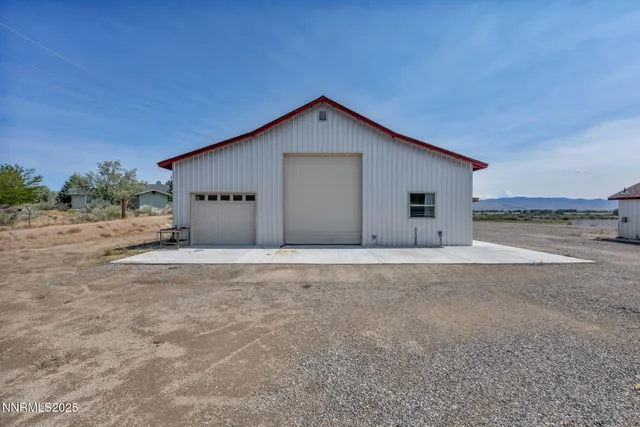 a view of a house with backyard space