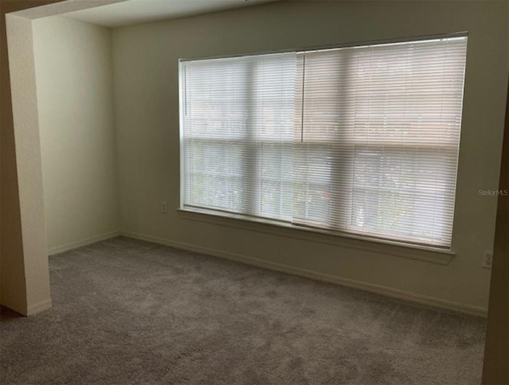 5455 Vineland Road, Unit 3106 Orlando, FL 32811 - Photo 5 of 6 an empty room with a window