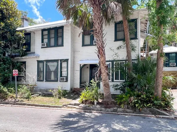 a front view of a house with yard
