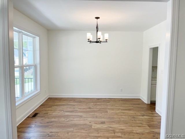 9249 Moldova Road Chesterfield, VA 23832 - Photo 4 of 22 wooden floor in an empty room with a window
