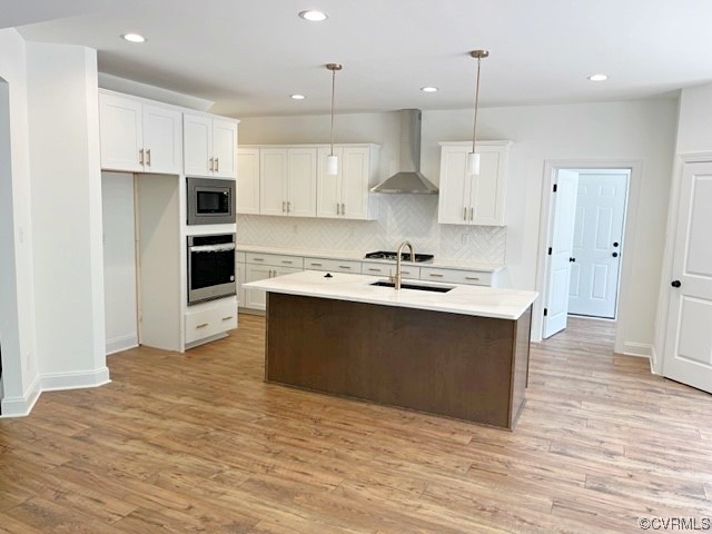 9249 Moldova Road Chesterfield, VA 23832 - Photo 6 of 22 a kitchen with kitchen island a sink stainless steel appliances and cabinets