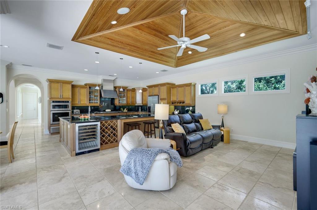 1284 Pocantico Lane Naples, FL 34110 - Photo 23 of 50 Inverted Wood Panel Tray Ceiling Enhances the Organic Design