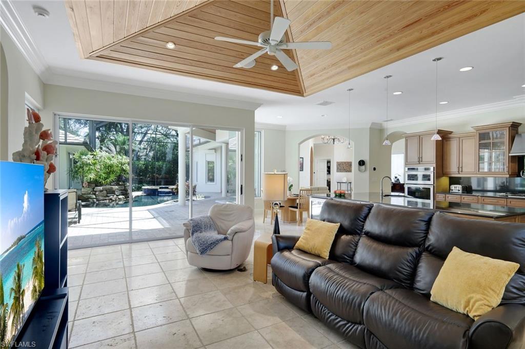 1284 Pocantico Lane Naples, FL 34110 - Photo 24 of 50 Family Room w/ 10-Ft. Sliding Glass Doors to Lanai