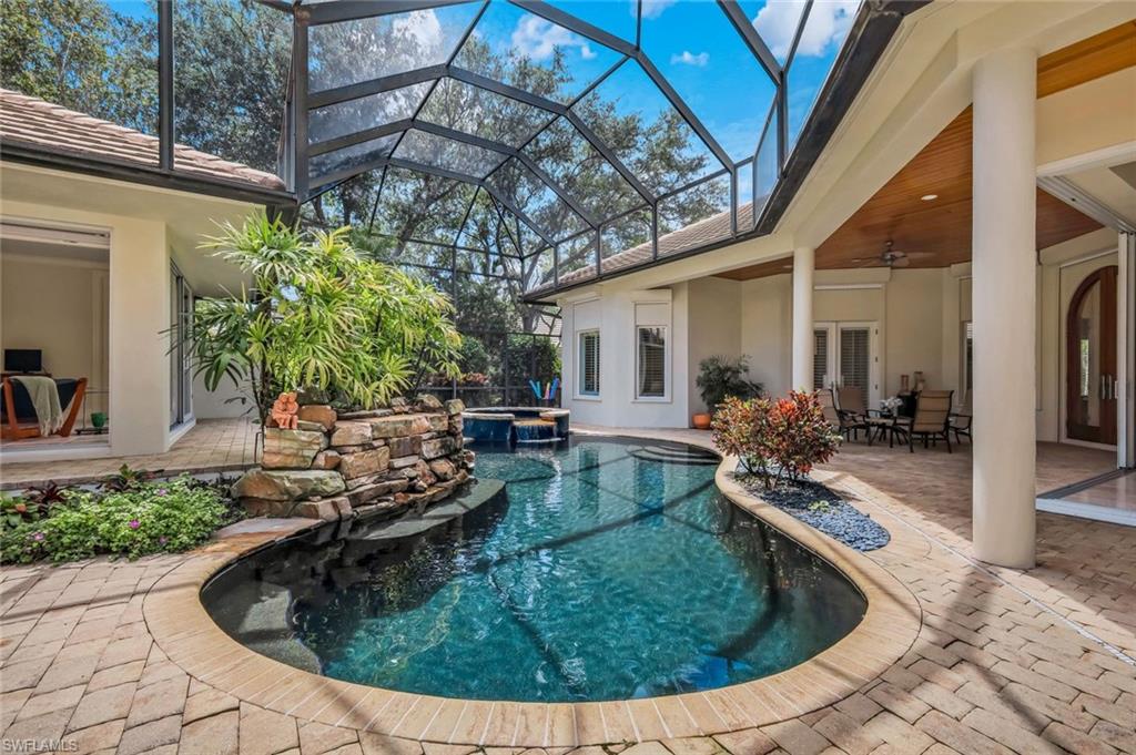 1284 Pocantico Lane Naples, FL 34110 - Photo 26 of 50 Lagoon-Style Pool w/ Hot Tub