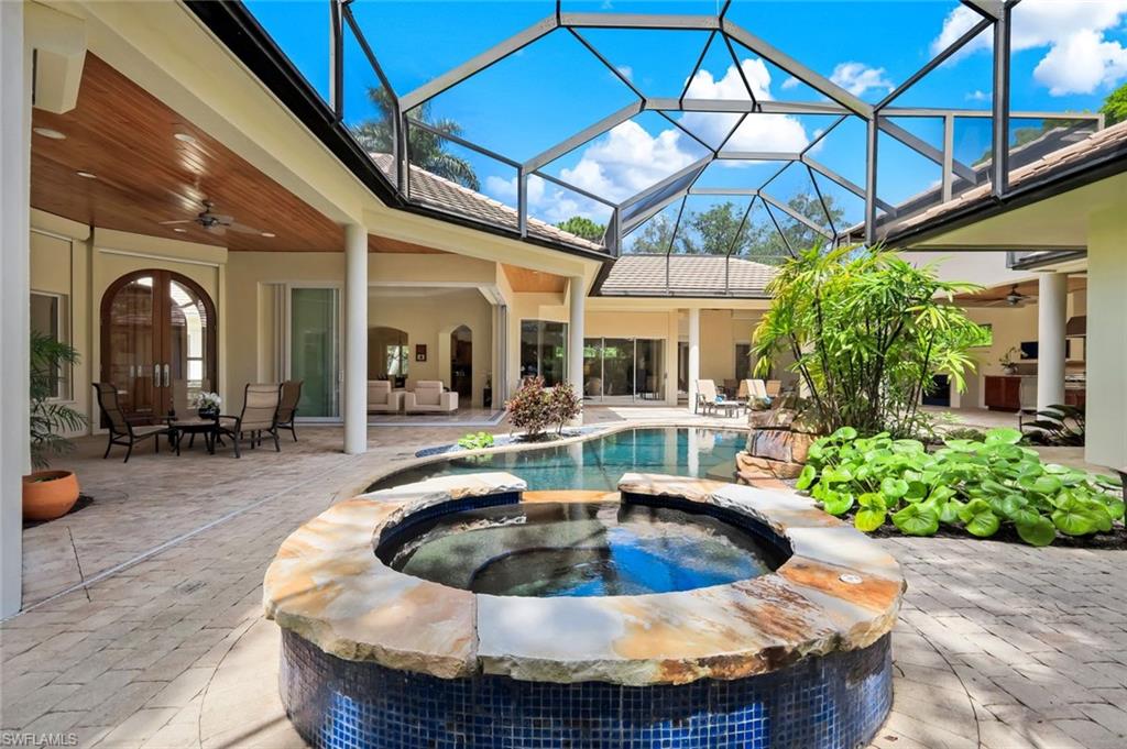 1284 Pocantico Lane Naples, FL 34110 - Photo 30 of 50 Impact-Rated Sliding Glass Doors & Motorized Shutters for Hurricane Resilience