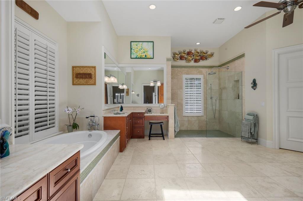 1284 Pocantico Lane Naples, FL 34110 - Photo 36 of 50 Marble-Topped Tub Surround, Dual Vanities & Makeup Vanity