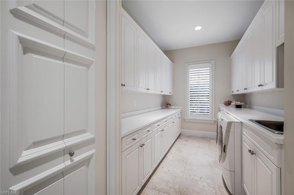 1284 Pocantico Lane Naples, FL 34110 - Photo 42 of 50 Utility Room w/ Large Closet & Extensive Cabinetry