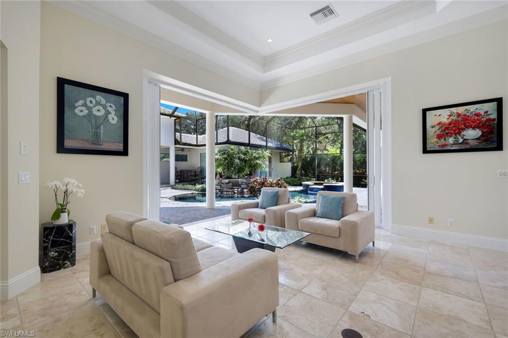 1284 Pocantico Lane Naples, FL 34110 - Photo 7 of 50 Zero-Corner Telescoping Glass Doors Open to the Outdoors