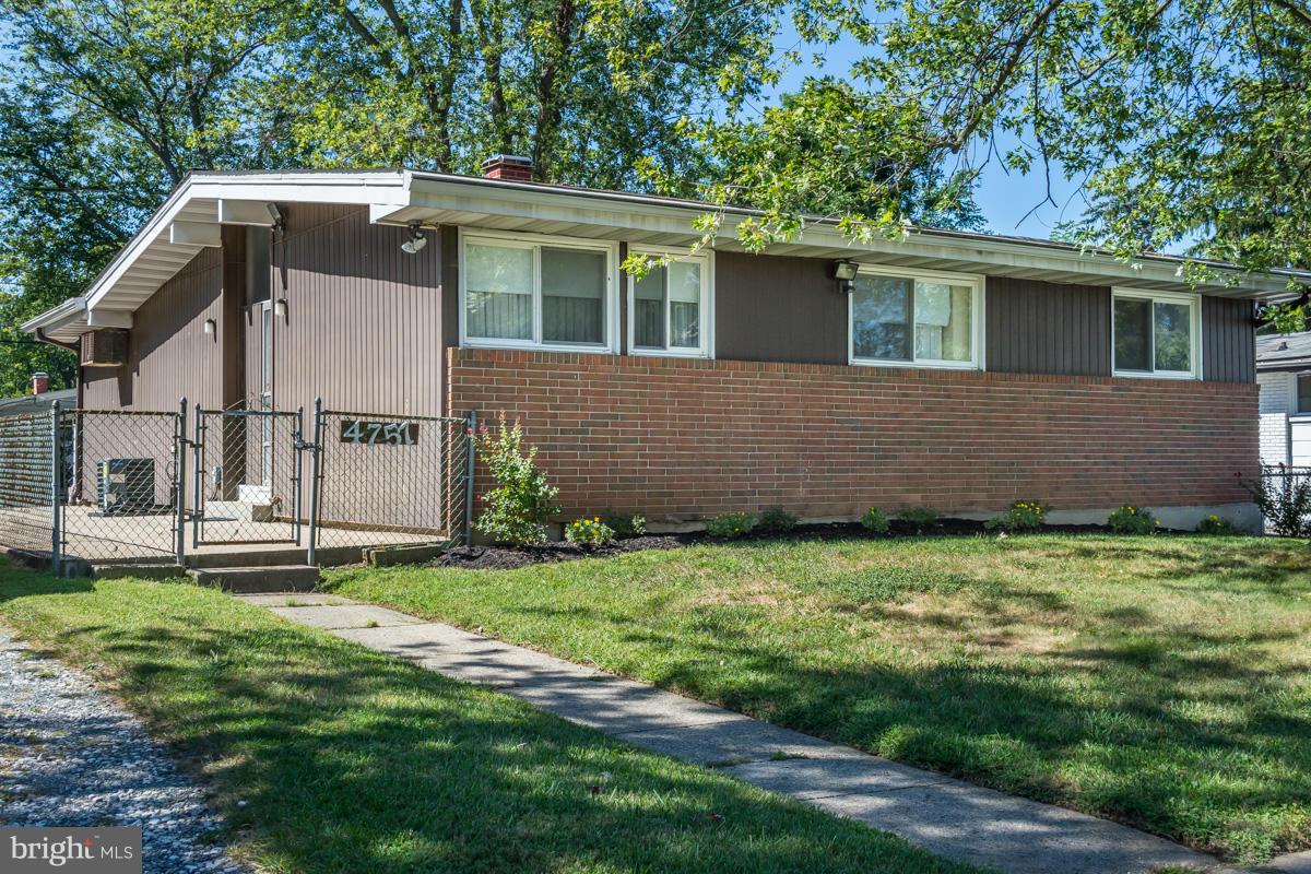 4757 Bonnie Brae Road Pikesville, MD 21208 - Photo 2 of 30 a view of a house with a yard