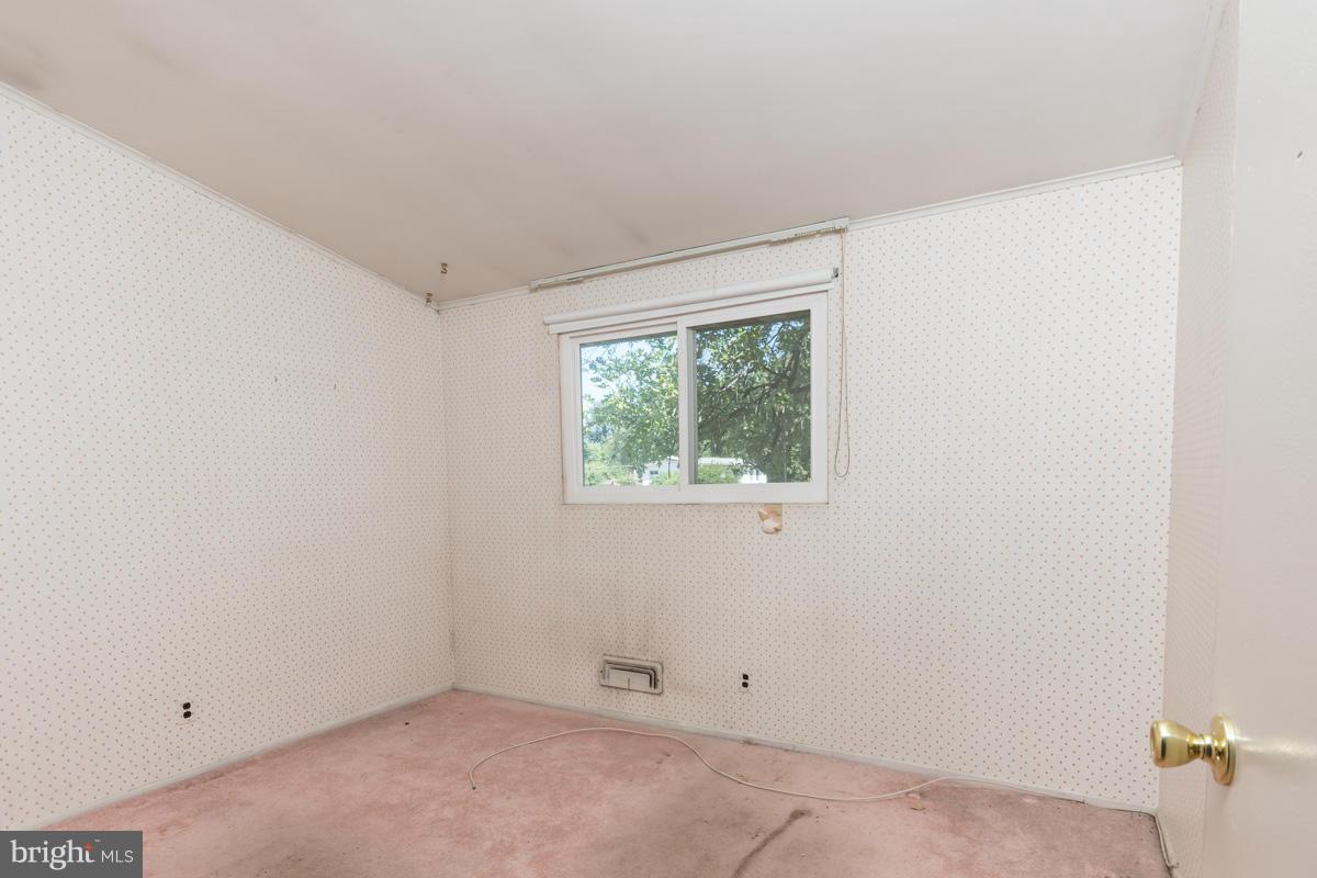 4757 Bonnie Brae Road Pikesville, MD 21208 - Photo 11 of 30 an empty room with a window