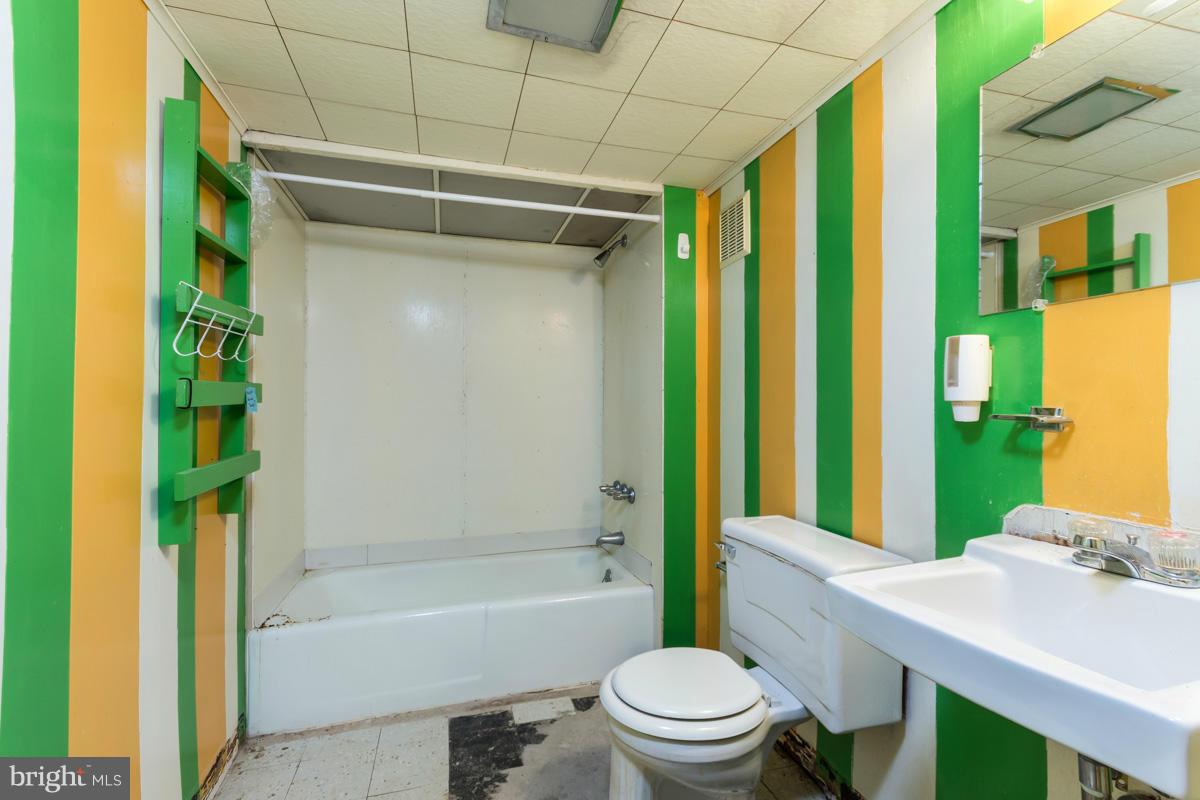 4757 Bonnie Brae Road Pikesville, MD 21208 - Photo 21 of 30 a bathroom with a sink toilet and shower
