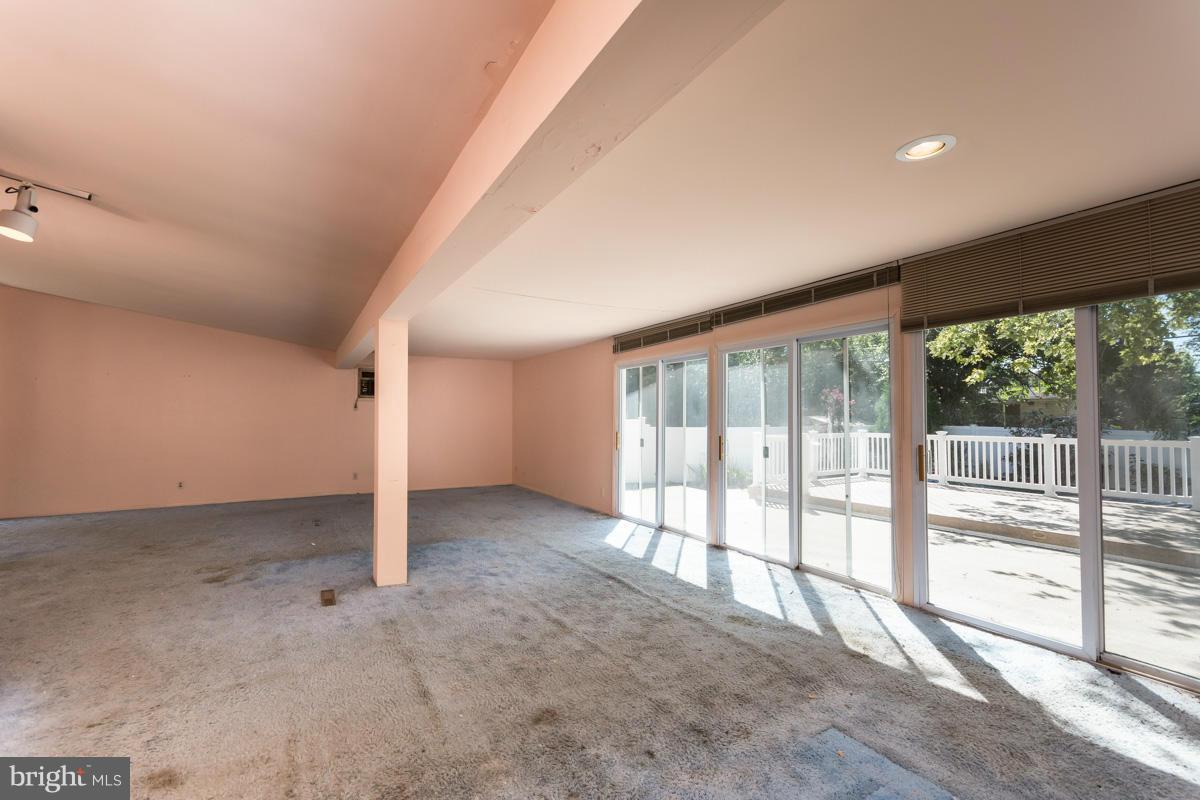 4757 Bonnie Brae Road Pikesville, MD 21208 - Photo 7 of 30 a view of an empty room with a large window