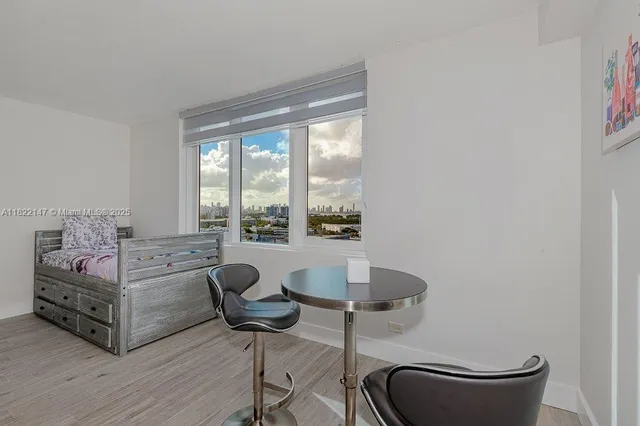 a room with granite countertop furniture and a wooden floor