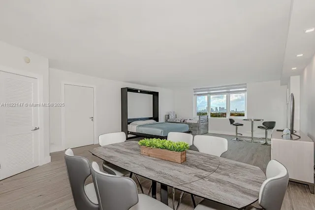 a living room with granite countertop furniture and wooden floor