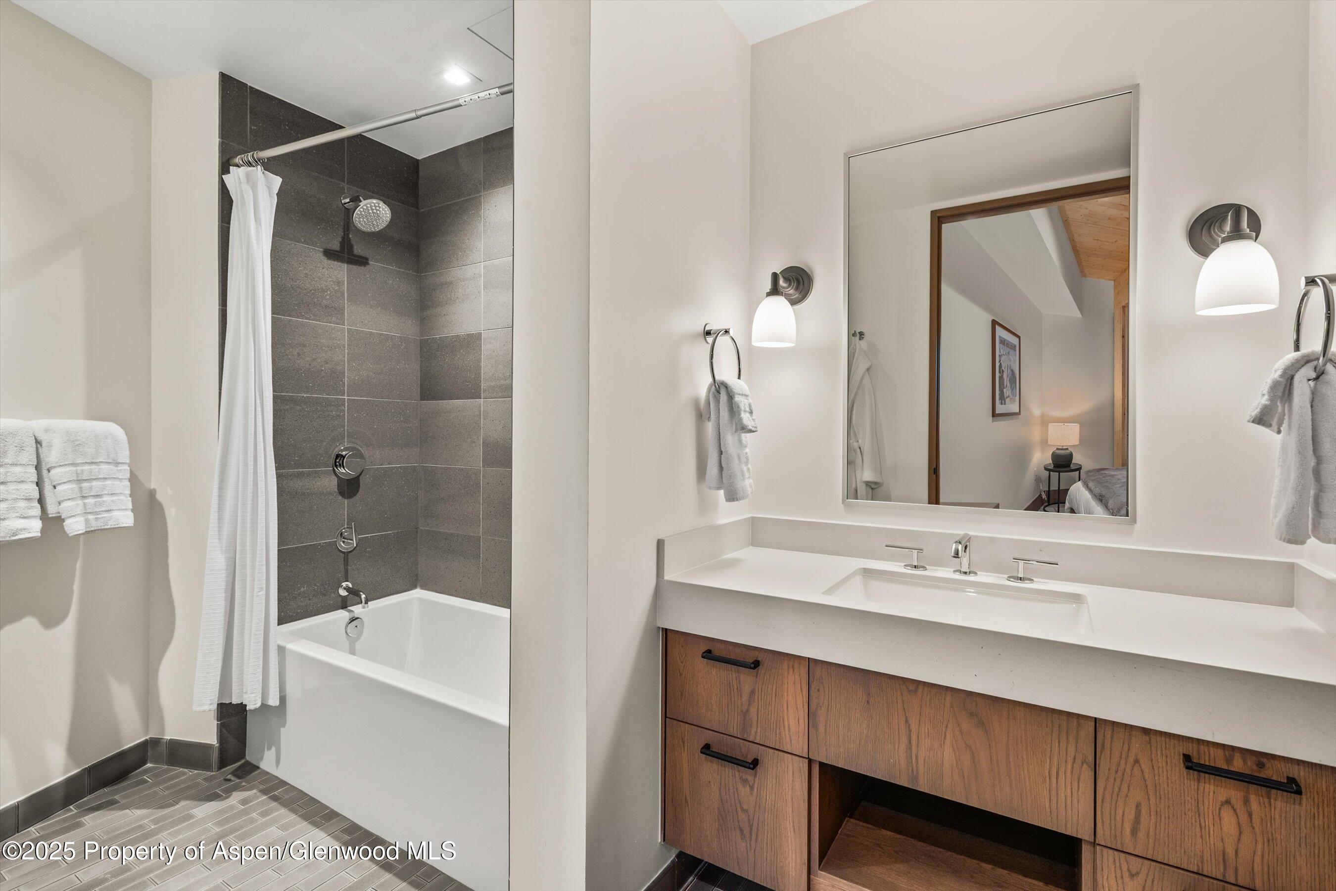 180 Wood Road, Unit 404 Snowmass Village, CO 81615 - Photo 16 of 51 404 4th bathroom with tub showera