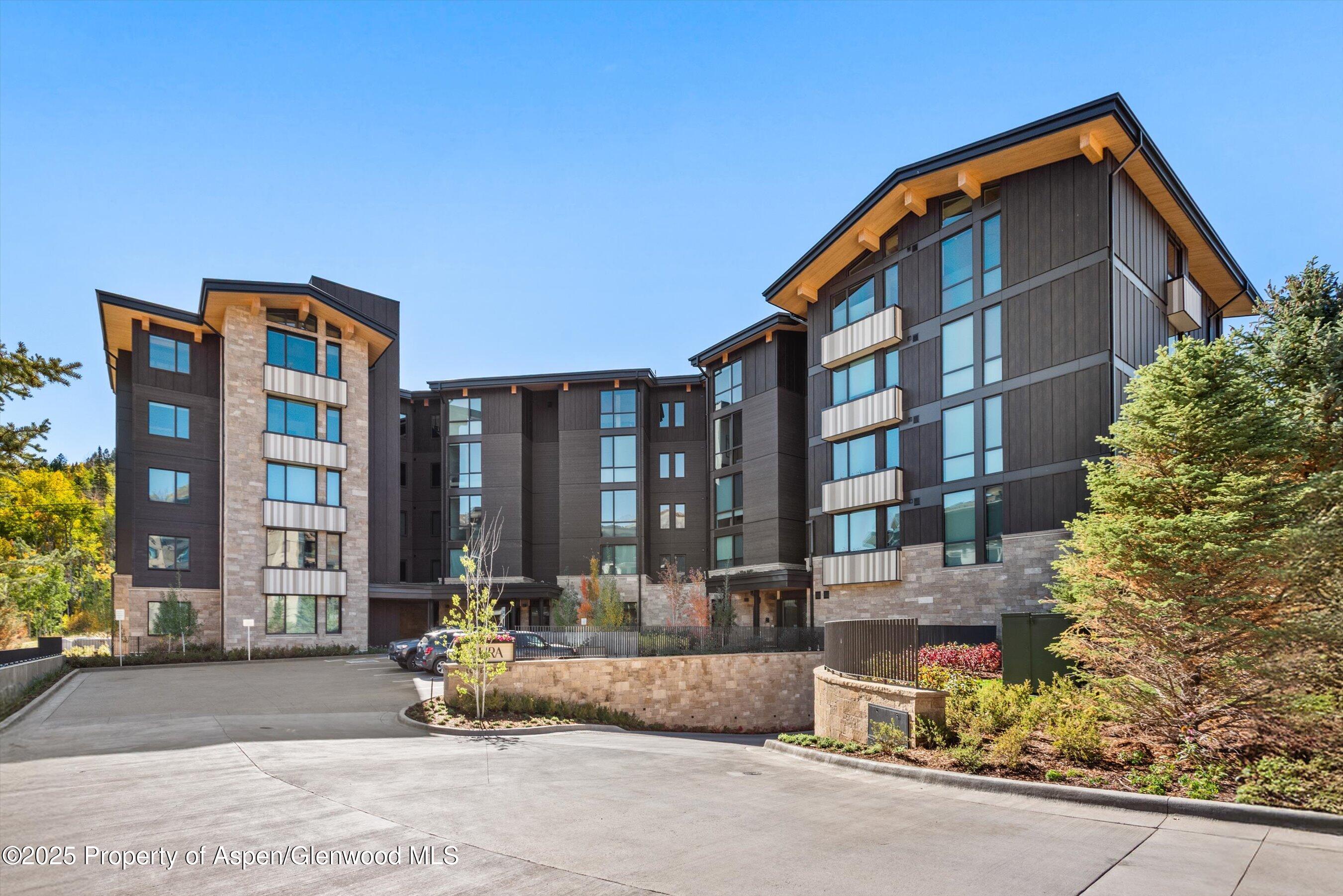 180 Wood Road, Unit 404 Snowmass Village, CO 81615 - Photo 18 of 51 a view of building with a outdoor space