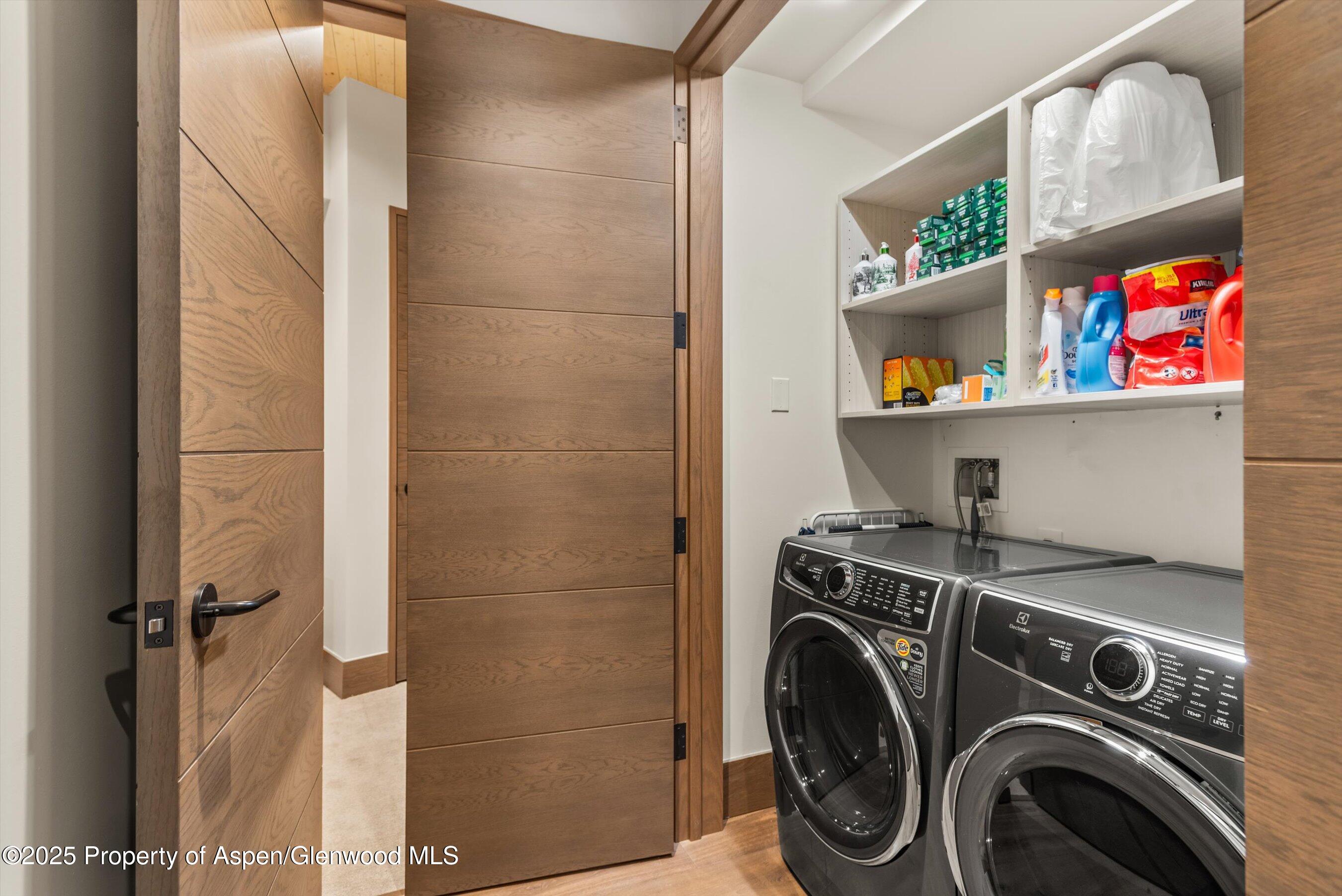 180 Wood Road, Unit 404 Snowmass Village, CO 81615 - Photo 31 of 51 a utility room with dryer and washer