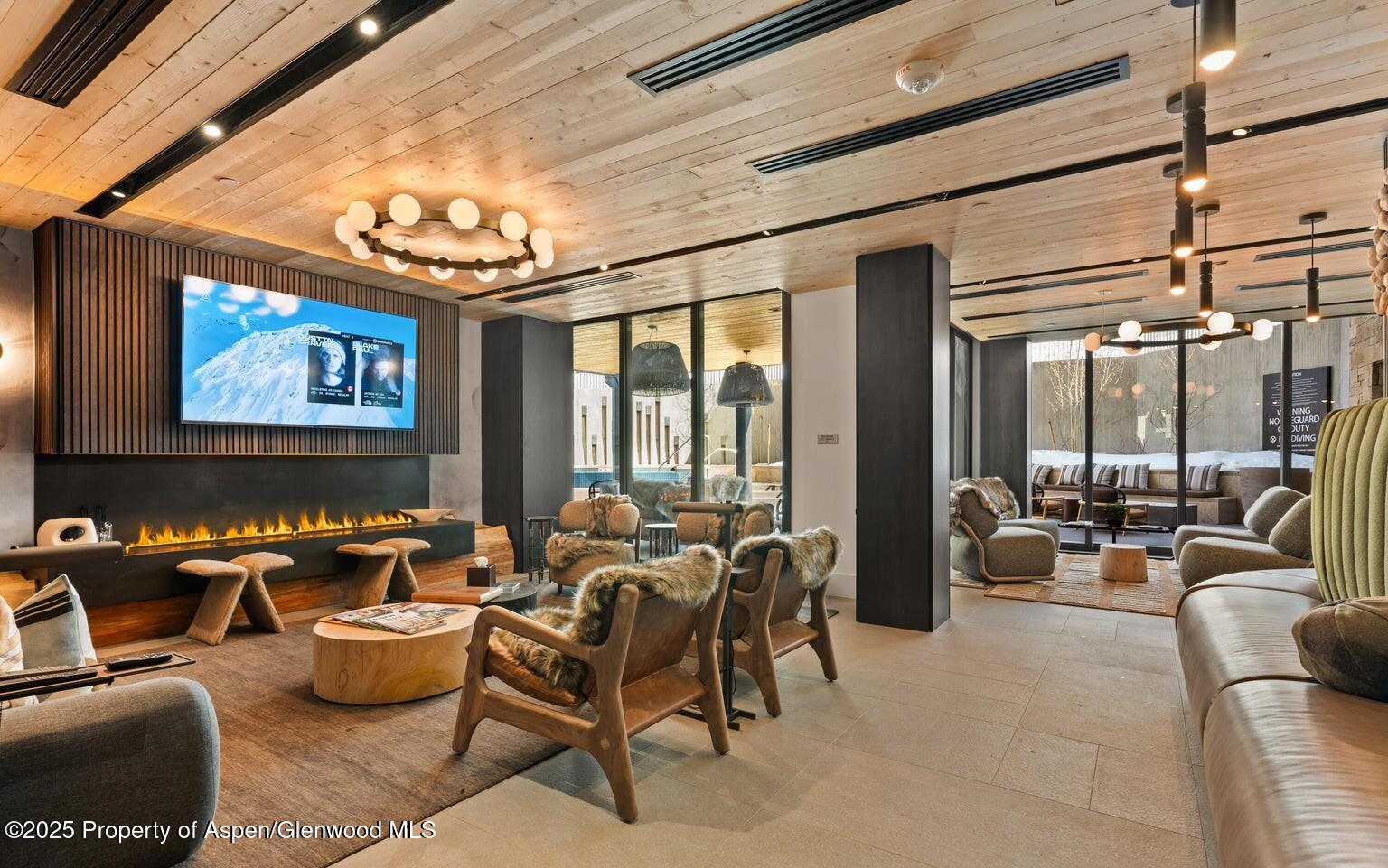 180 Wood Road, Unit 404 Snowmass Village, CO 81615 - Photo 36 of 51 a living room with furniture