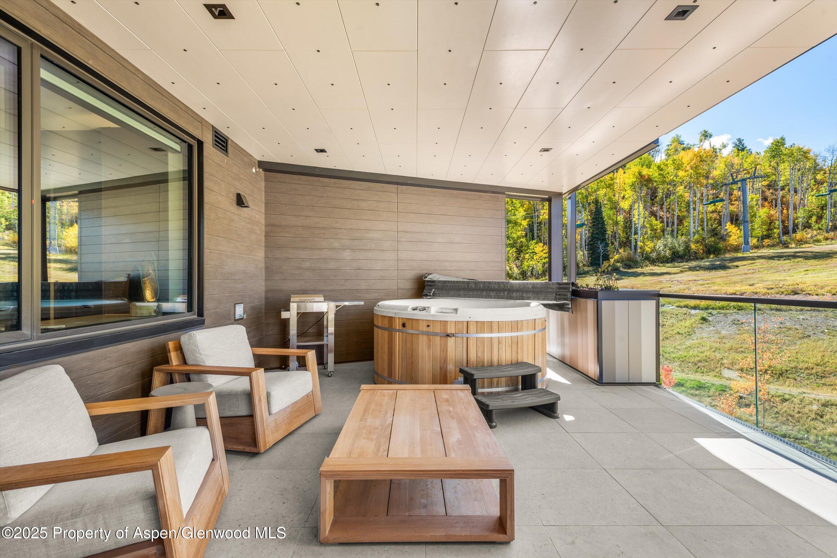 180 Wood Road, Unit 404 Snowmass Village, CO 81615 - Photo 42 of 51 404 private hot tub and grill on decka