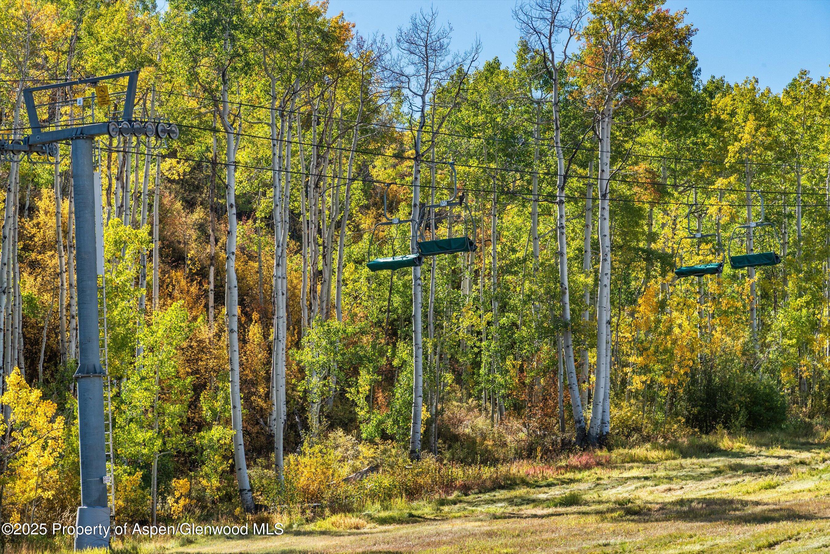 180 Wood Road, Unit 404 Snowmass Village, CO 81615 - Photo 46 of 51 404 view of chairlift from deck
