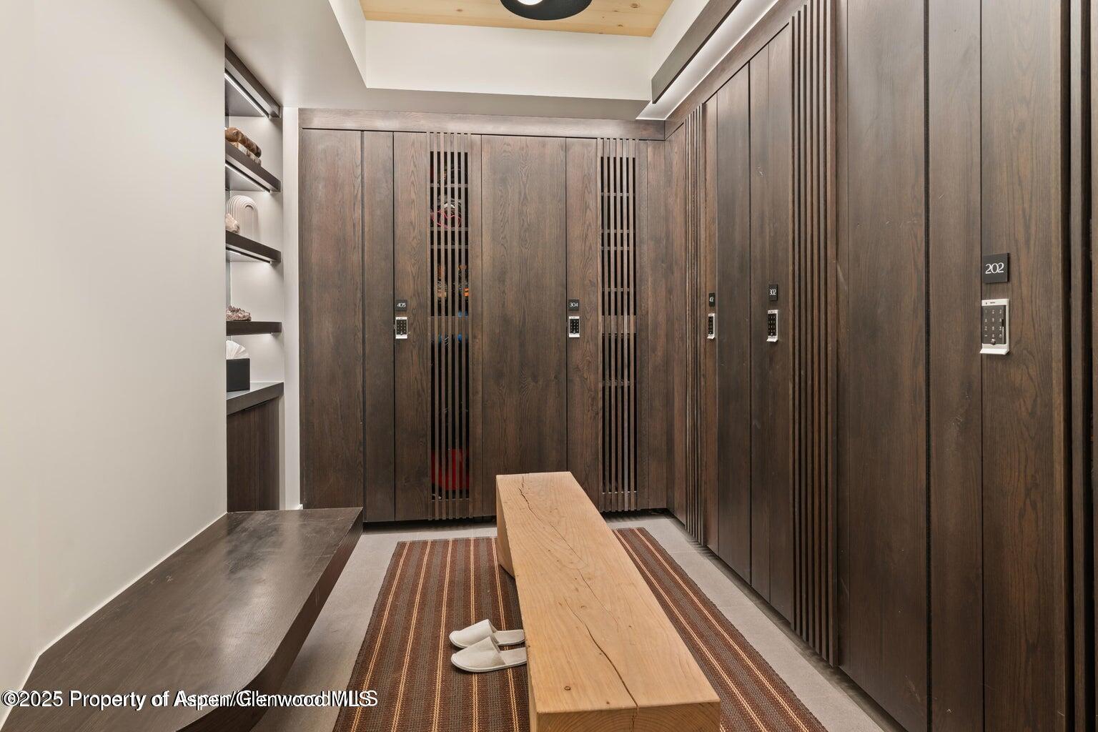 180 Wood Road, Unit 404 Snowmass Village, CO 81615 - Photo 51 of 51 a view of a hallway with wooden floor and staircase