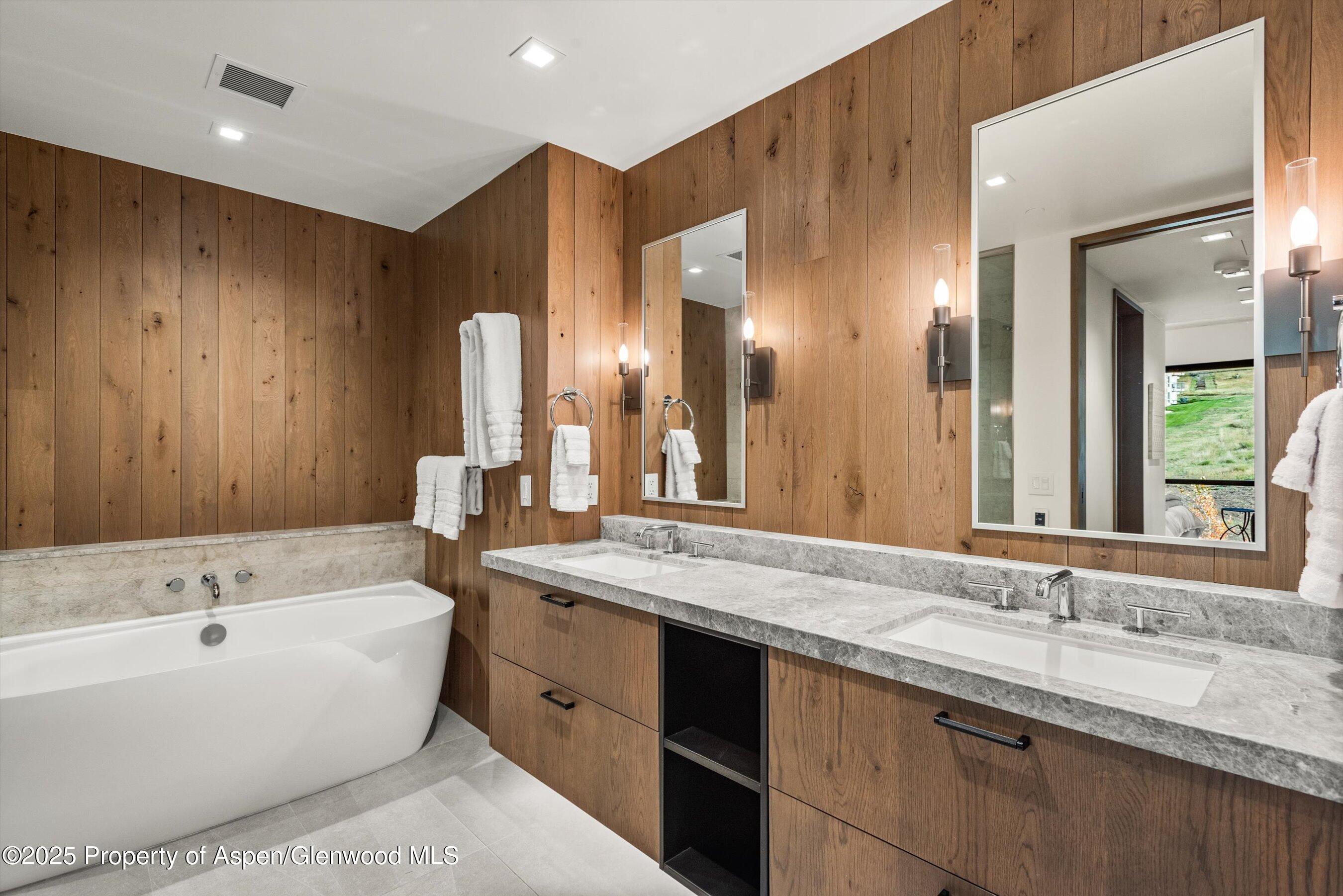 180 Wood Road, Unit 404 Snowmass Village, CO 81615 - Photo 8 of 51 404 Master bathroom with double vanitya