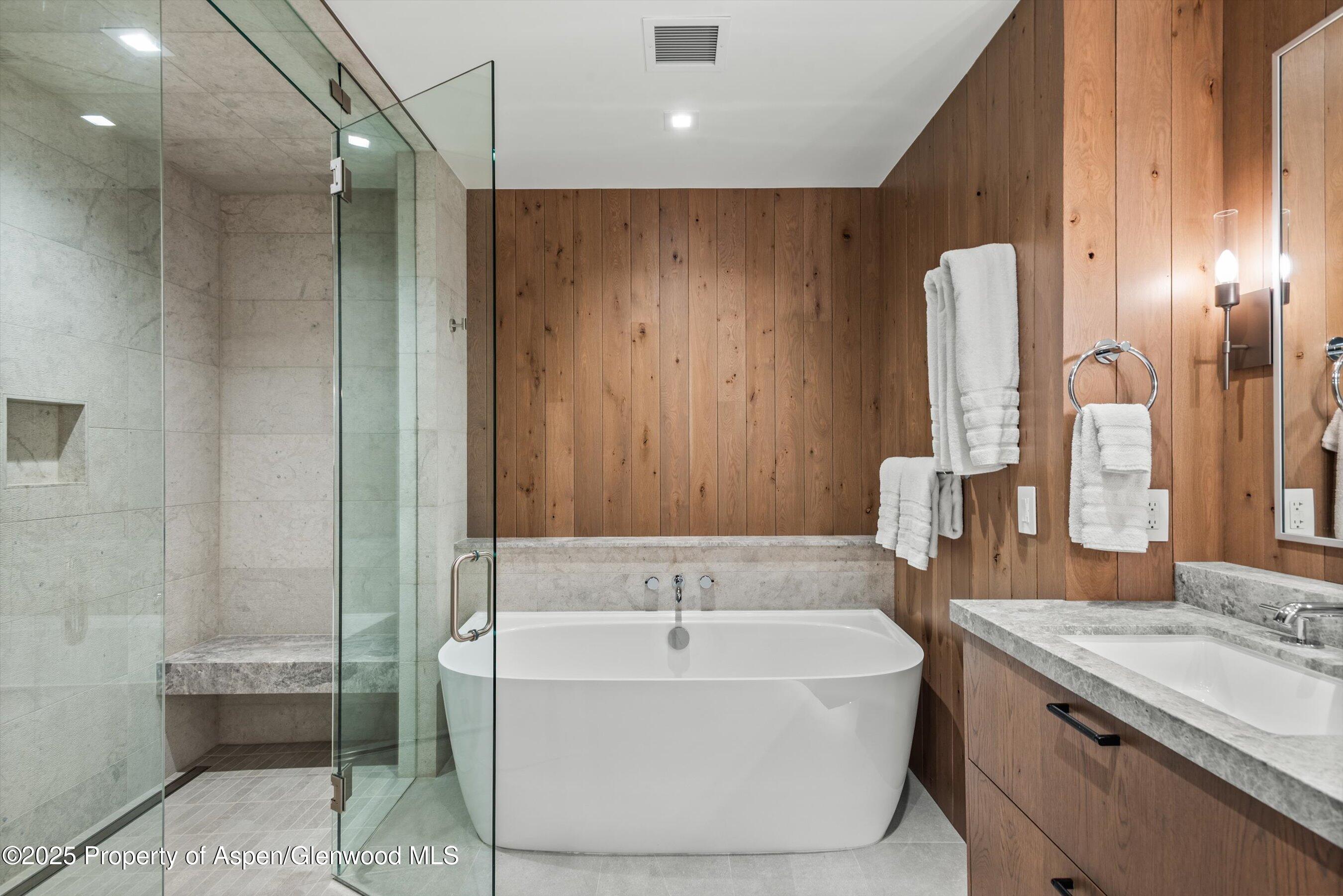 180 Wood Road, Unit 404 Snowmass Village, CO 81615 - Photo 9 of 51 a bathroom with a bathtub and a sink