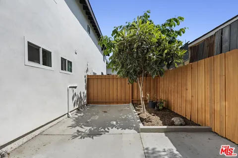 a view of a house with a small yard