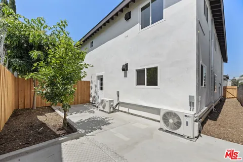 a backyard of a house with seating space