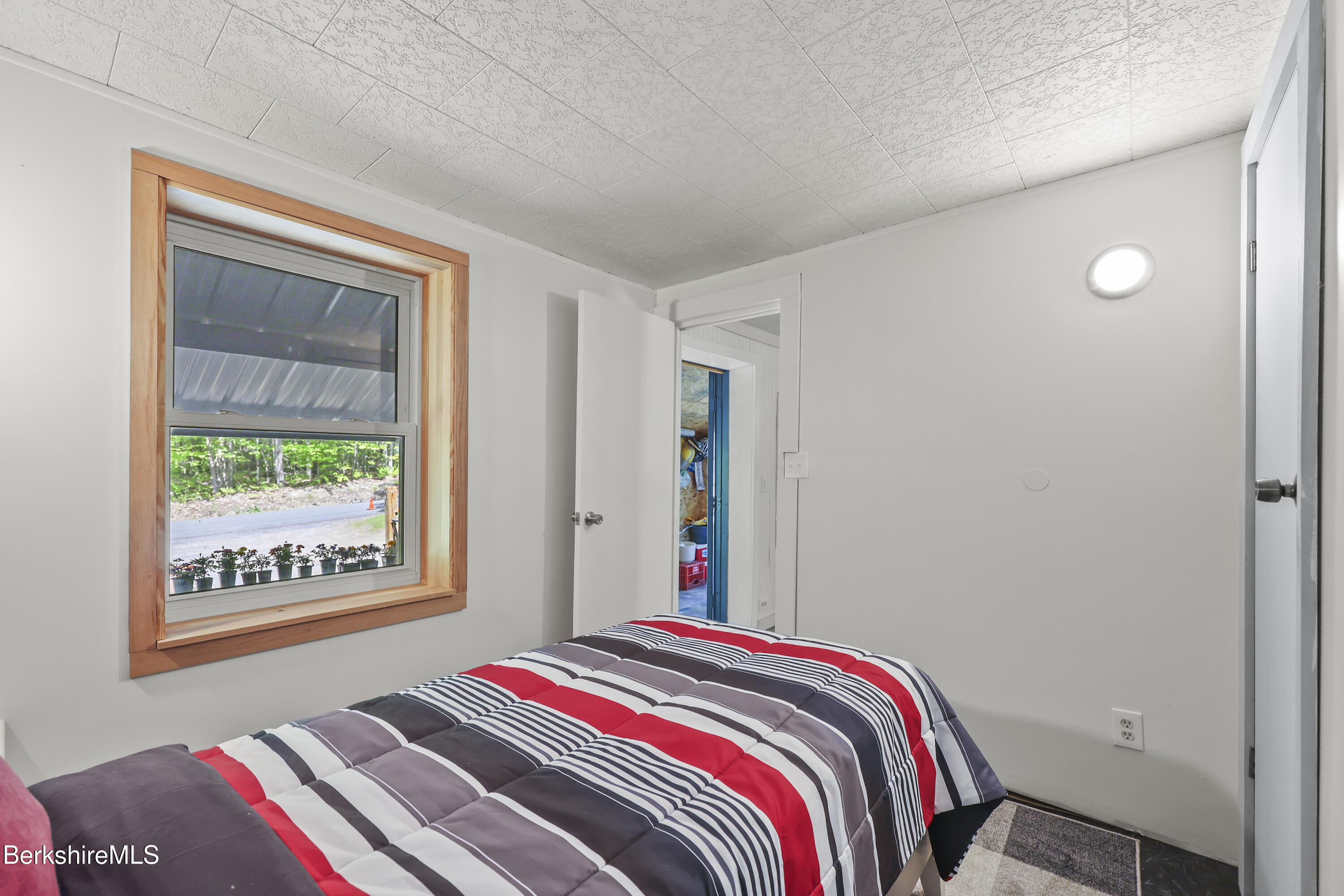 192 Curran Road Cheshire, MA 01225 - Photo 25 of 50 a bed sitting in a bedroom next to a window
