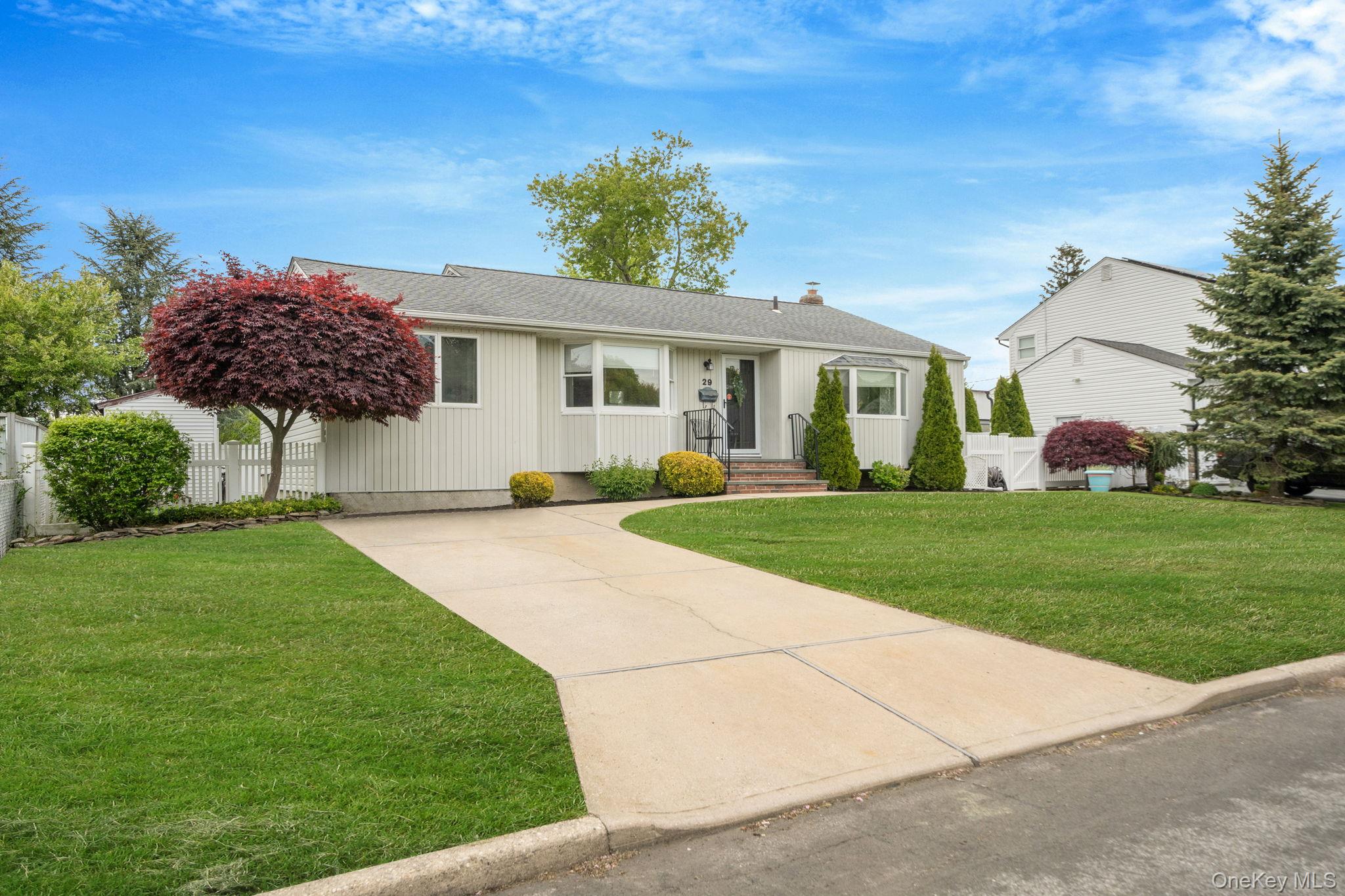 29 Franklin Street Islip, NY 11751 - Photo 2 of 39 a front view of house with yard and green space