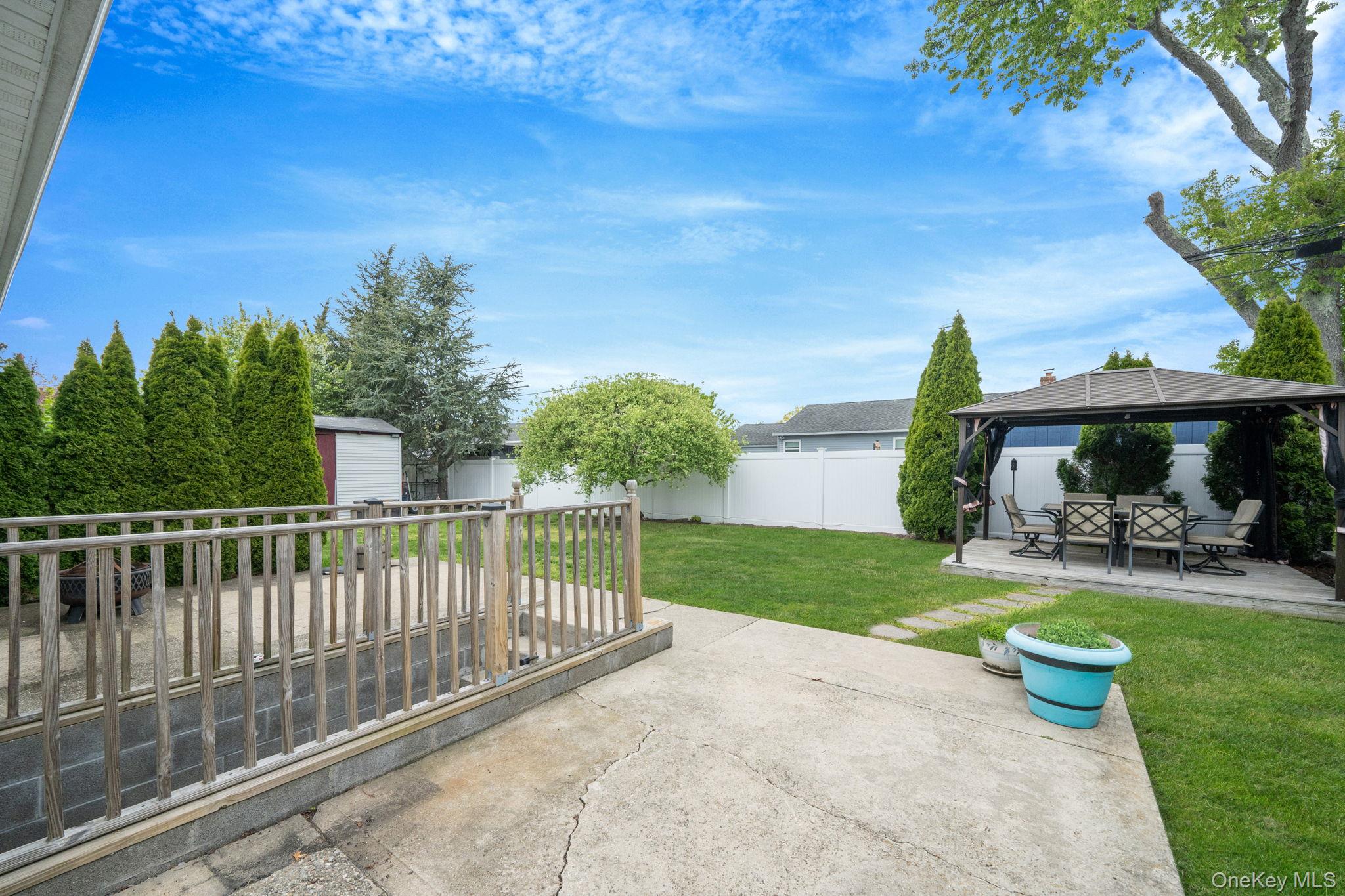 29 Franklin Street Islip, NY 11751 - Photo 29 of 39 a view of a house with backyard and sitting area